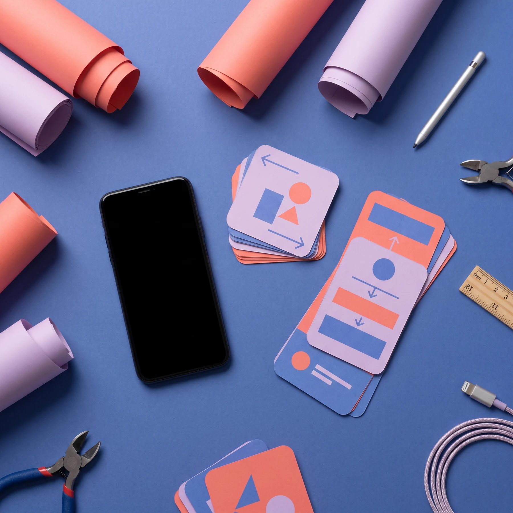 A flat lay of mobile design materials and a smartphone