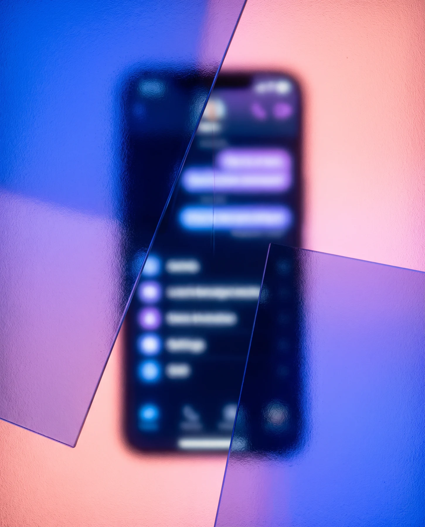 A blurred smartphone screen with blue and coral light